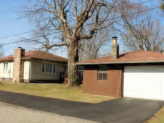 View of side of home & detached garage