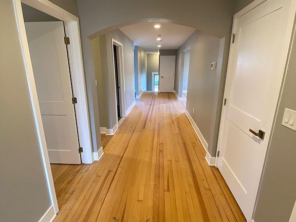 Large hallway leading to bedrooms, bathrooms, kitchen and family room. Almost wide enough to make a seating area