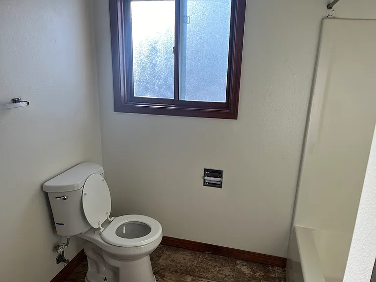 Full main bath with tub and shower.