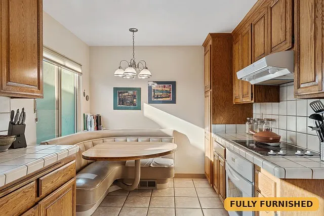 Eat-in dinette with booth seating in the kitchen