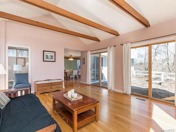 Two sliders in living room open to patio.