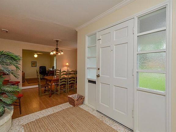 The windows on either side of the front door allow for natural light. Notice the mail slot. Your mail will be safe and secure in your own home. The formal dining area is up front and beyond is the study. You could flip them if you wanted.