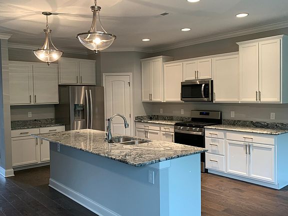 Beautiful kitchen with upgraded granite and fixtures Plus gas stove and ss appliances including refrigerator
