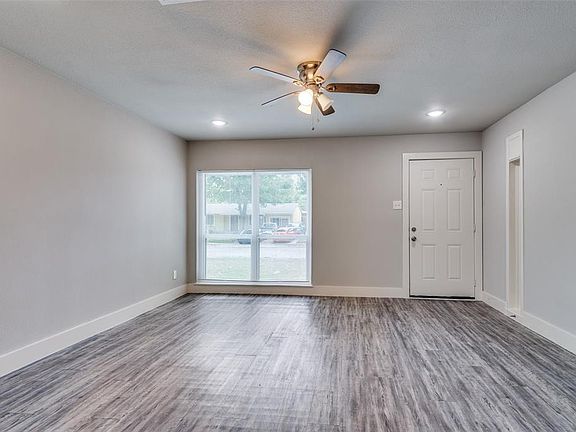 Spare room featuring ceiling fan and wood-type flooring
