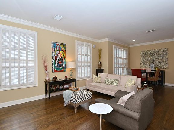 Large living area that leads into the dining area behind