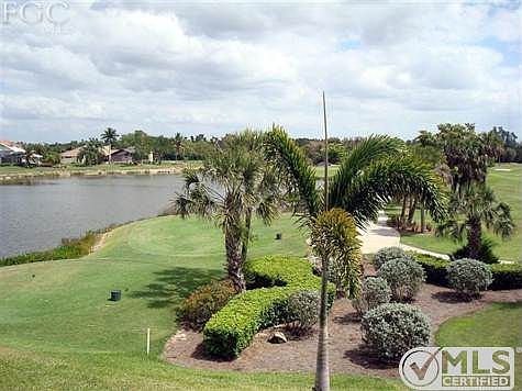 View of lake and golf course from the screened lanai