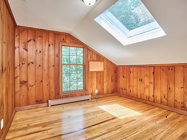 Bedroom upstairs with skylight; also works well as office.