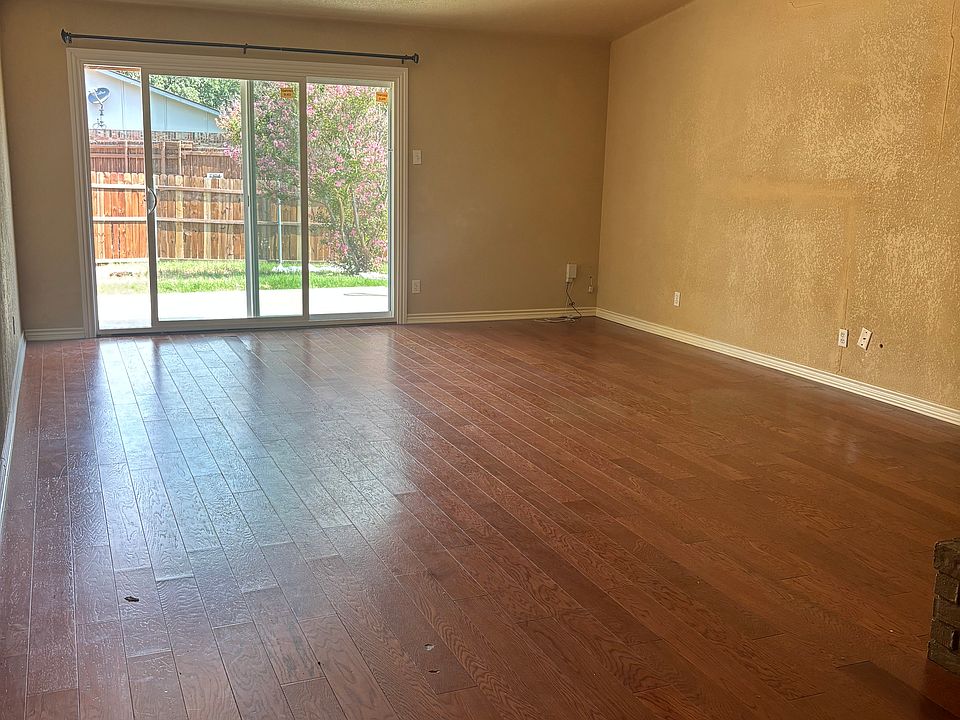 Oversized living room, leads to backyard. New sliding glass door
