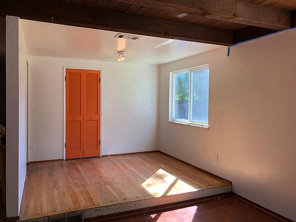 A den is next to the kitchen