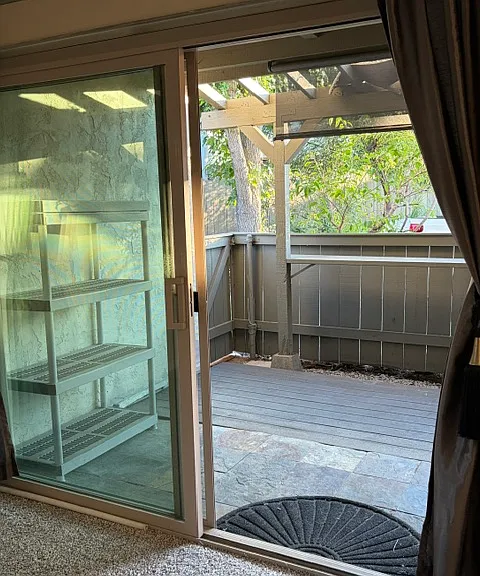 New sliding glass door and newly rebuilt front deck. Slate and trex decking.
