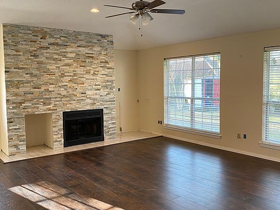 Spacious family roof featuring a beautiful slate wall over the fireplace!