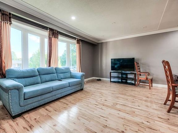 Living room with hardwood...