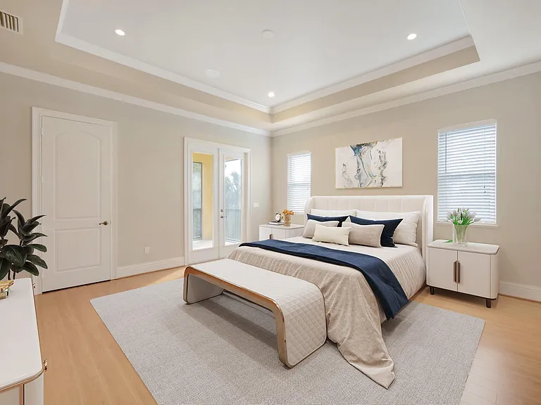 Expansive primary bedroom suite with a spa master bathroom and a private balcony.
