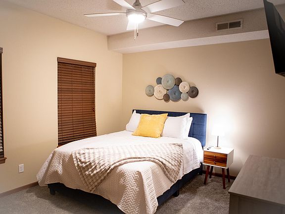 High-end mattress with extra bedding, sheets, and a smart tv in each bedroom