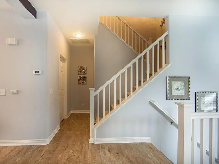 Stairway to all Beds across the powder room