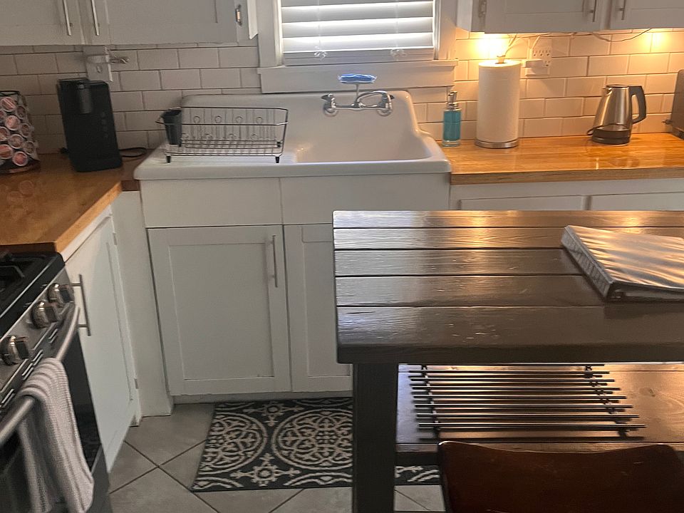 Kitchen with beautiful antique sink.