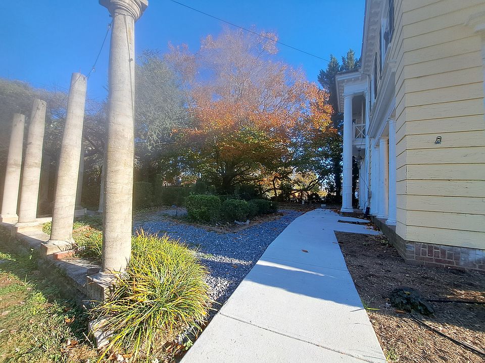 Entry sidewalk to main door, porch entry and private garden.