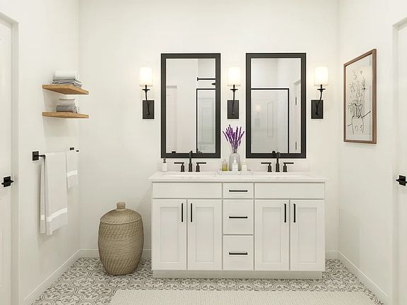 Primary bath features vanity with dual sinks