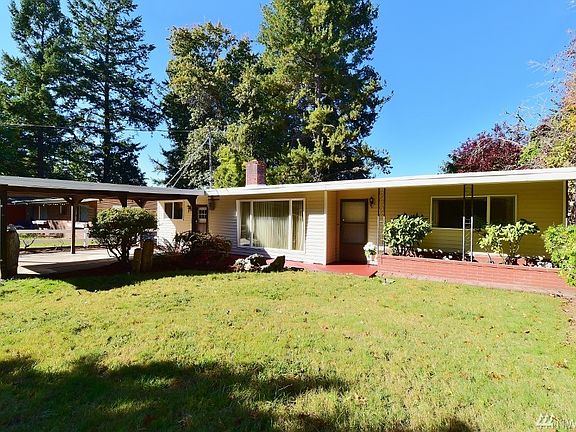 Front view across the yard - Note the brick planter near front door.