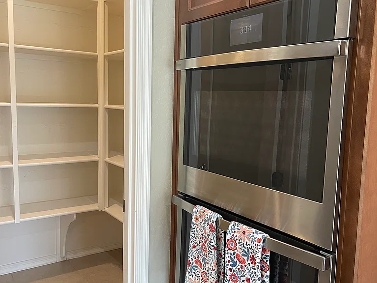 Double ovens and walk in pantry.