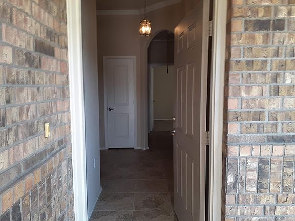 FRONT DOOR ENRANCE TO FOYER