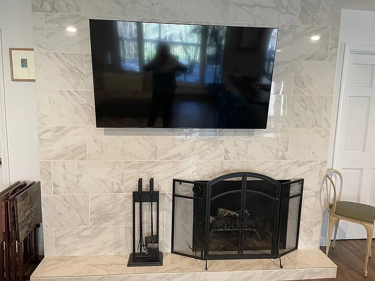 60" tv and fireplace.