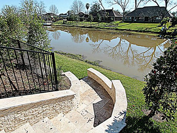 GORGEOUS STONE STEPS LEAD RIGHT DOWN TO THE WATERFRONT