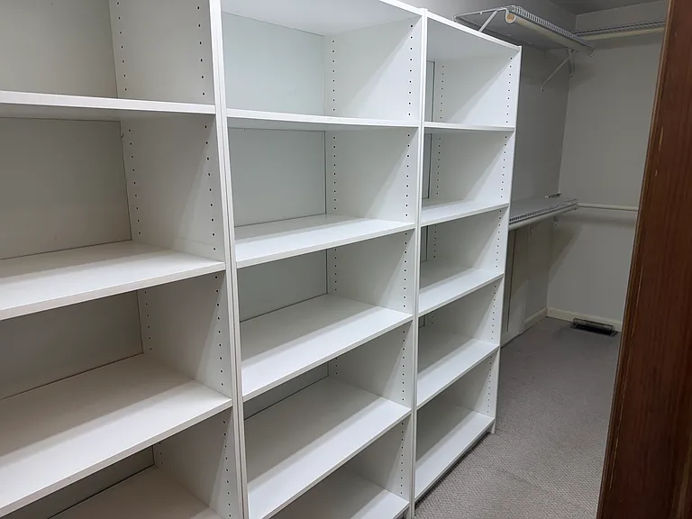 upstairs, primary bedroom walk in closet
