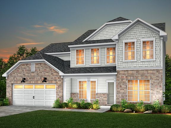 Wingate Exterior 6 features stone, siding, shakes, covered front sitting porch and 2 car garage