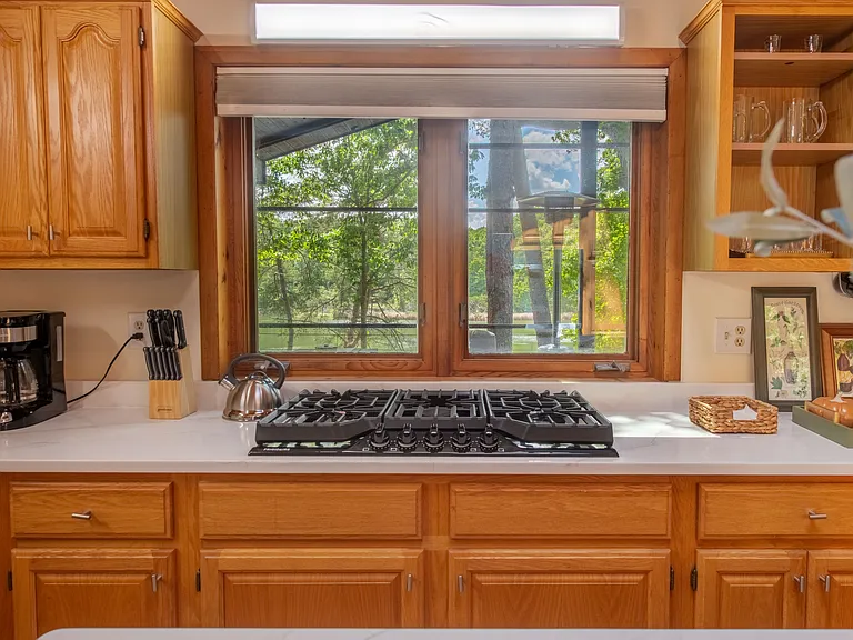 Five burner gas counter top range, overlooking waterfront.