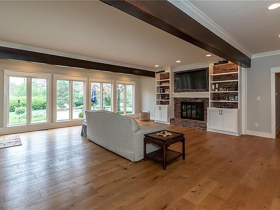 Beautiful Great Room w/Newer Floors and Bookcases and  Beams added.