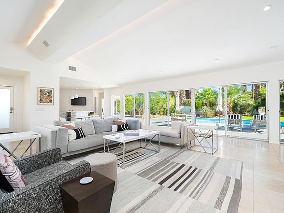Living view room of pool towards kitchen area.