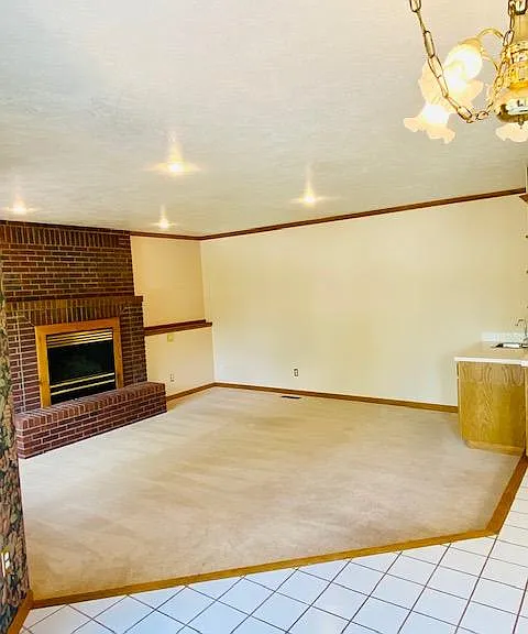 View of family room with fireplace and wetbar