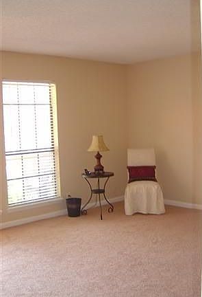 Large Living Area with New Carpet and Paint