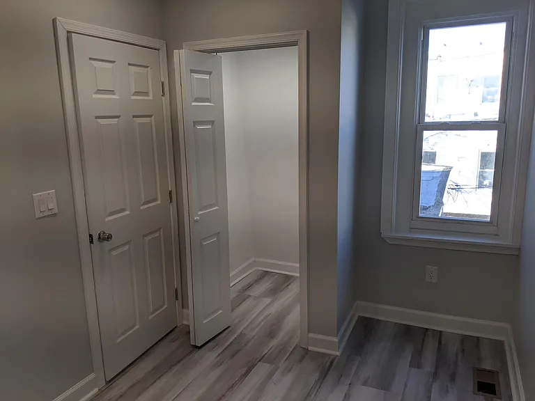 Third floor bedroom with a walk-in closet