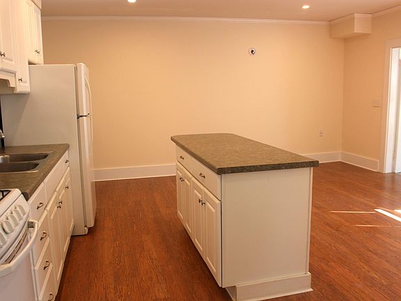 Open living/kitchen and dining area.