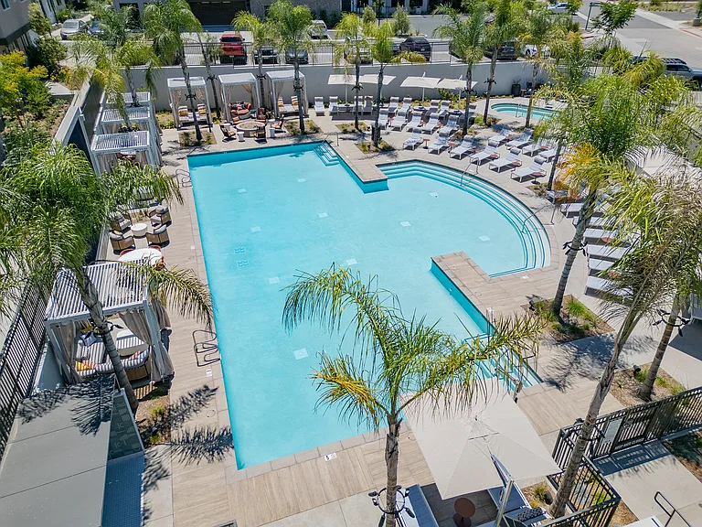 Luxurious Outdoor Pool with Cabanas and Sun Loungers