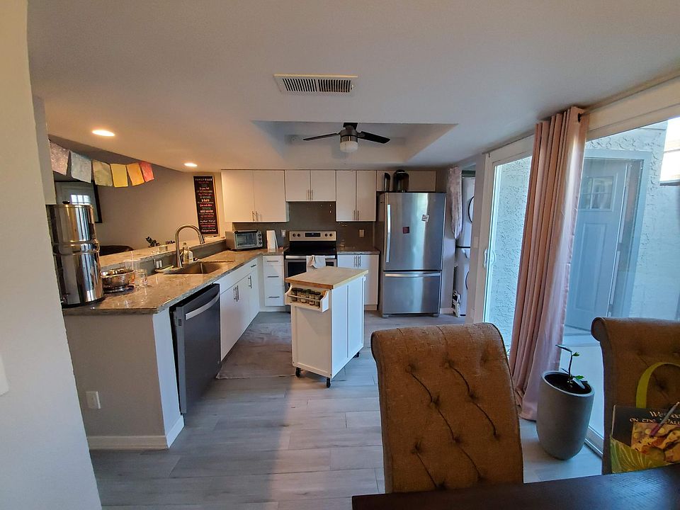 Kitchen standing by kitchen table