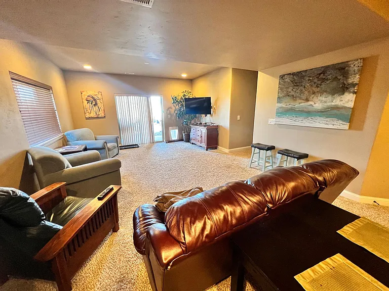 Comfortable sitting area w/large wall mounted Smart-TV. Ping-Pong Table access, walk-out basement, Dining table