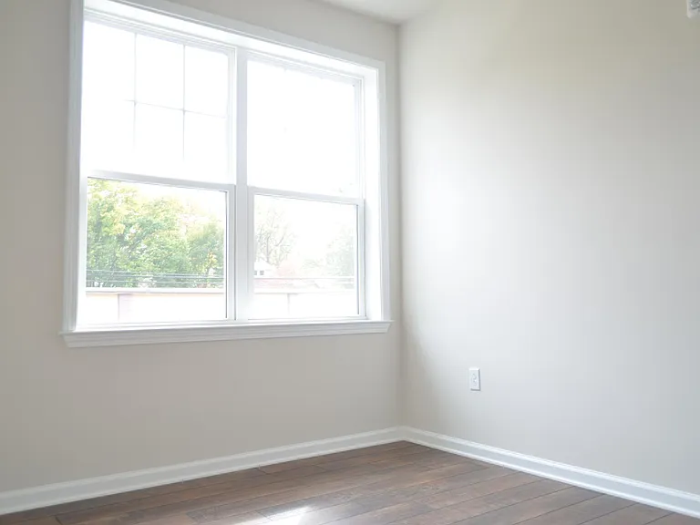One of the three bedrooms with a view of Cleveland Ave.