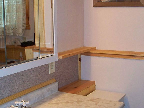 Bathroom is updated and has laundry area