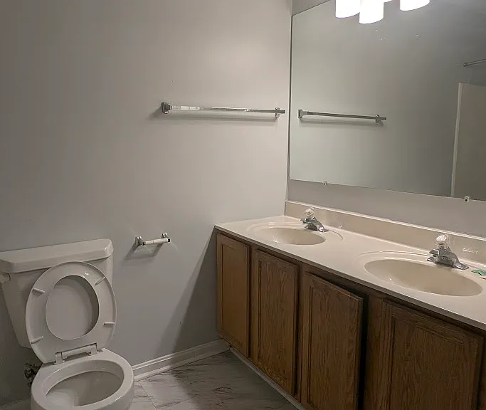 1st Restroom featuring two hand sinks