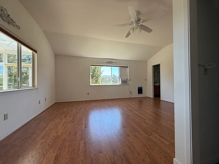 Bedroom entrance, 1/2 bath to rear on right, and entrance to closet on immediate right