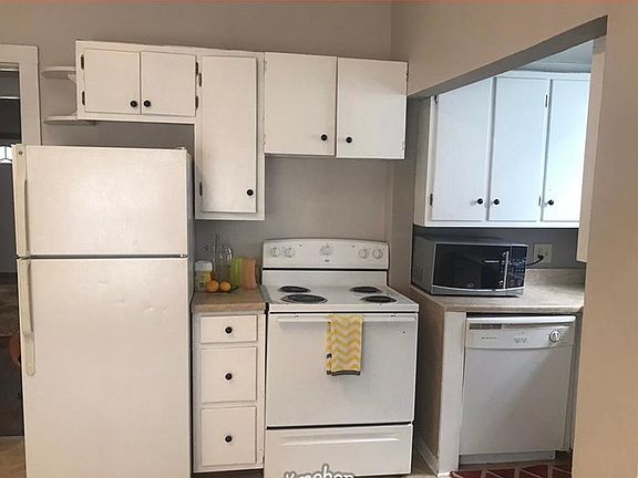 Kitchen with stove, frig and YES a dishwasher