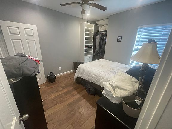 Guest bedroom, ensuite bathroom door behind. Closet installed 2022