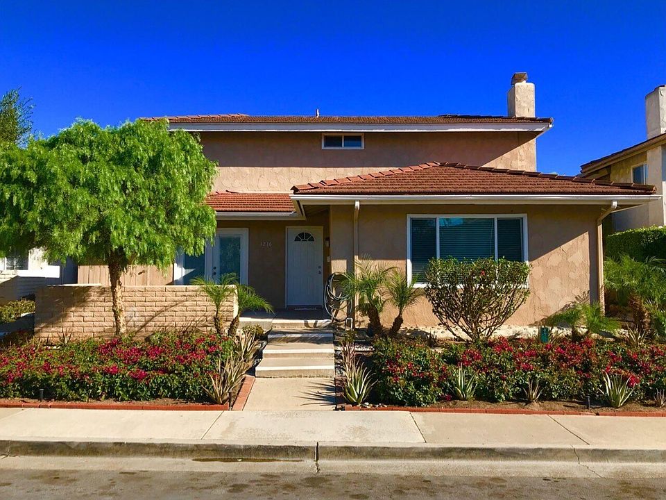 View of the entrance. There is a nice garden on either side as you walk up to the door. On the left is a private patio.