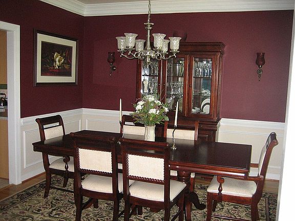 Formal Dining Room with Crown Molding, Chair Rail, and Picture Frame Molding