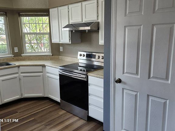 New electric stove and new range hood, vent to the outside.