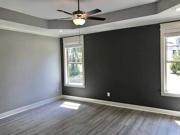 Large owner s suite downstairs with trey ceiling, fan and LED lights. Huge bathroom and walk in clo