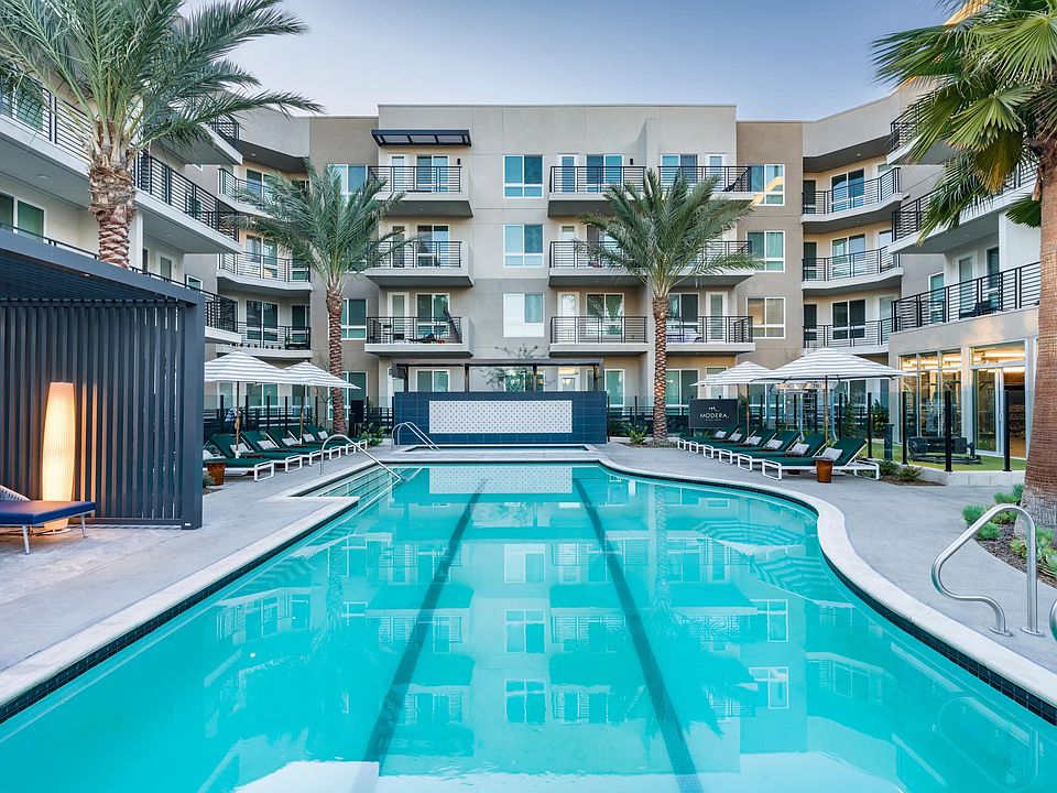Enjoy a resort-style pool with a peaceful lounge area at Modera Pomona.